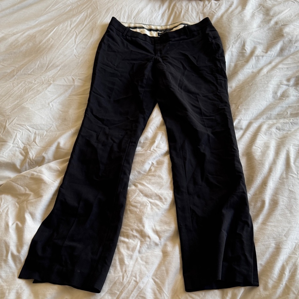 Black straight leg pants, opens at the ankle. Very cute. Size 2 in petite.
